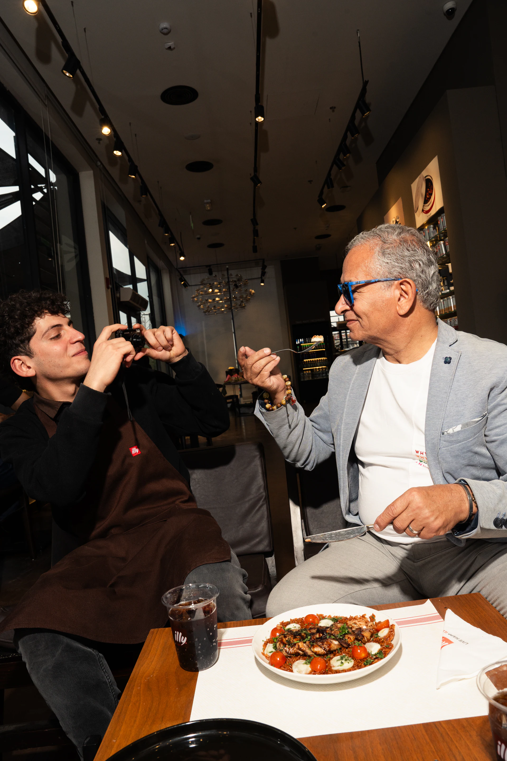 Certified mamma mia guests sharing an illy café meal