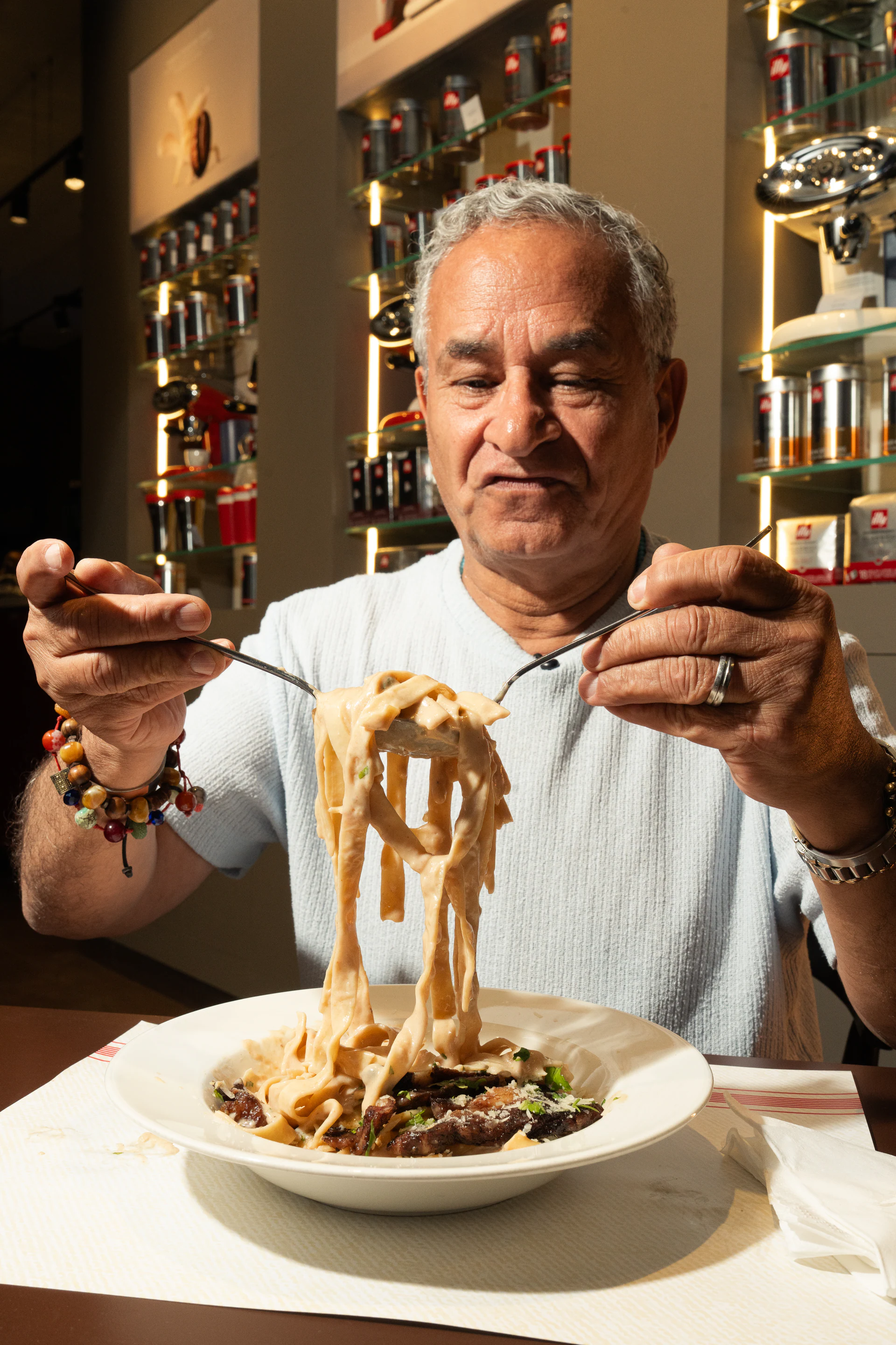 Certified mamma mia guest presenting a forkful of pasta