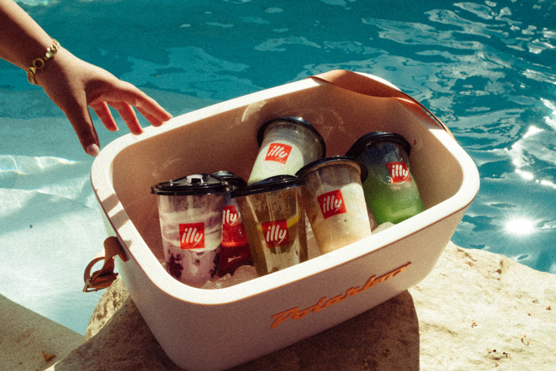 Selection of colorful illy summer drinks beside the pool