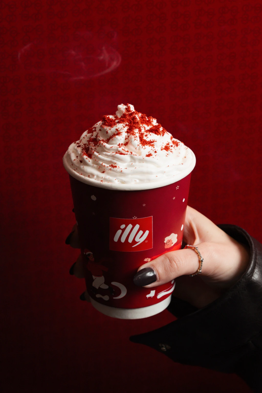illy winter campaign artwork featuring a red seasonal drink
