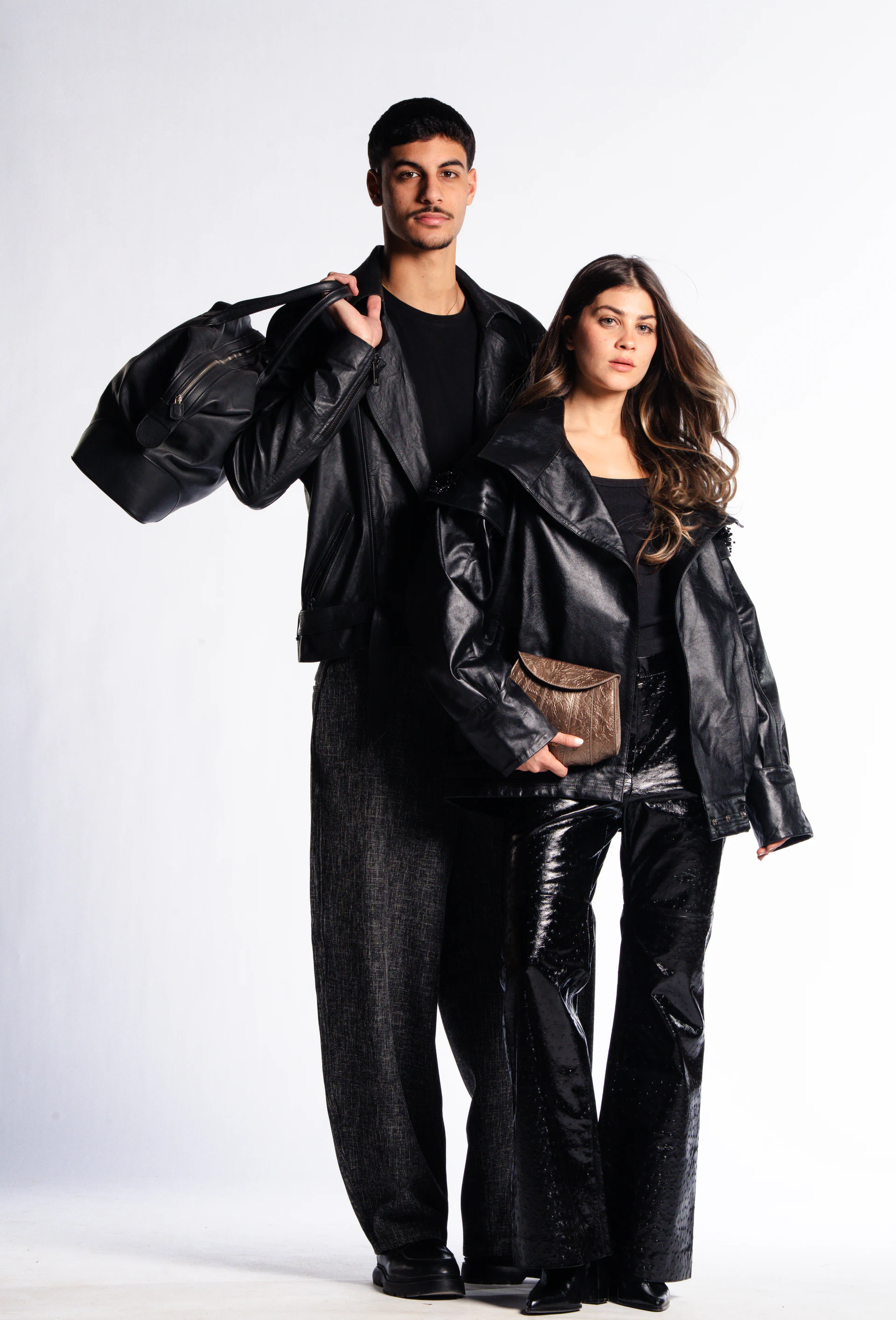 Leopelle editorial campaign portrait featuring two models in black leather