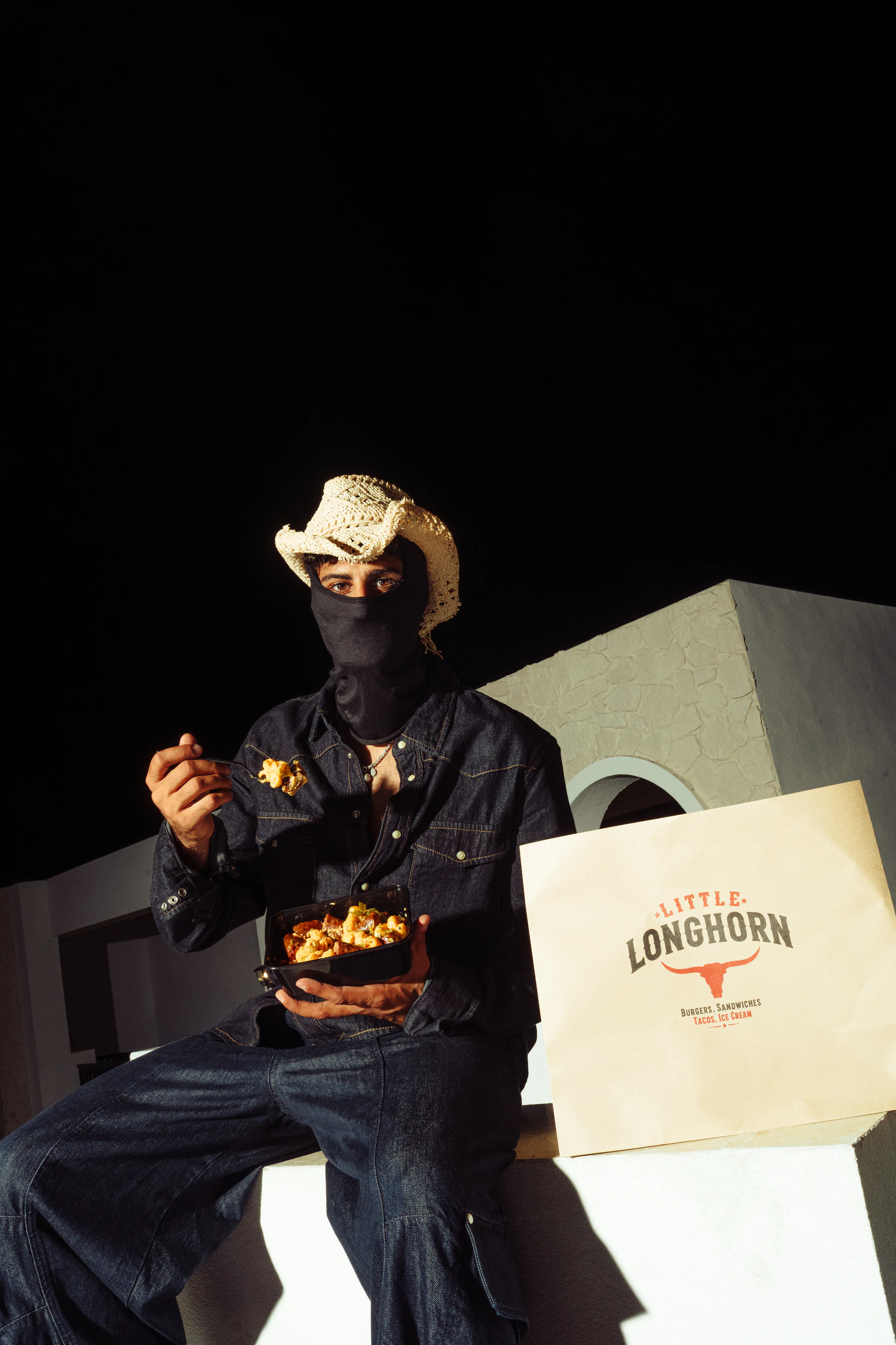 Masked Little LongHorn outlaw with branded takeaway bag