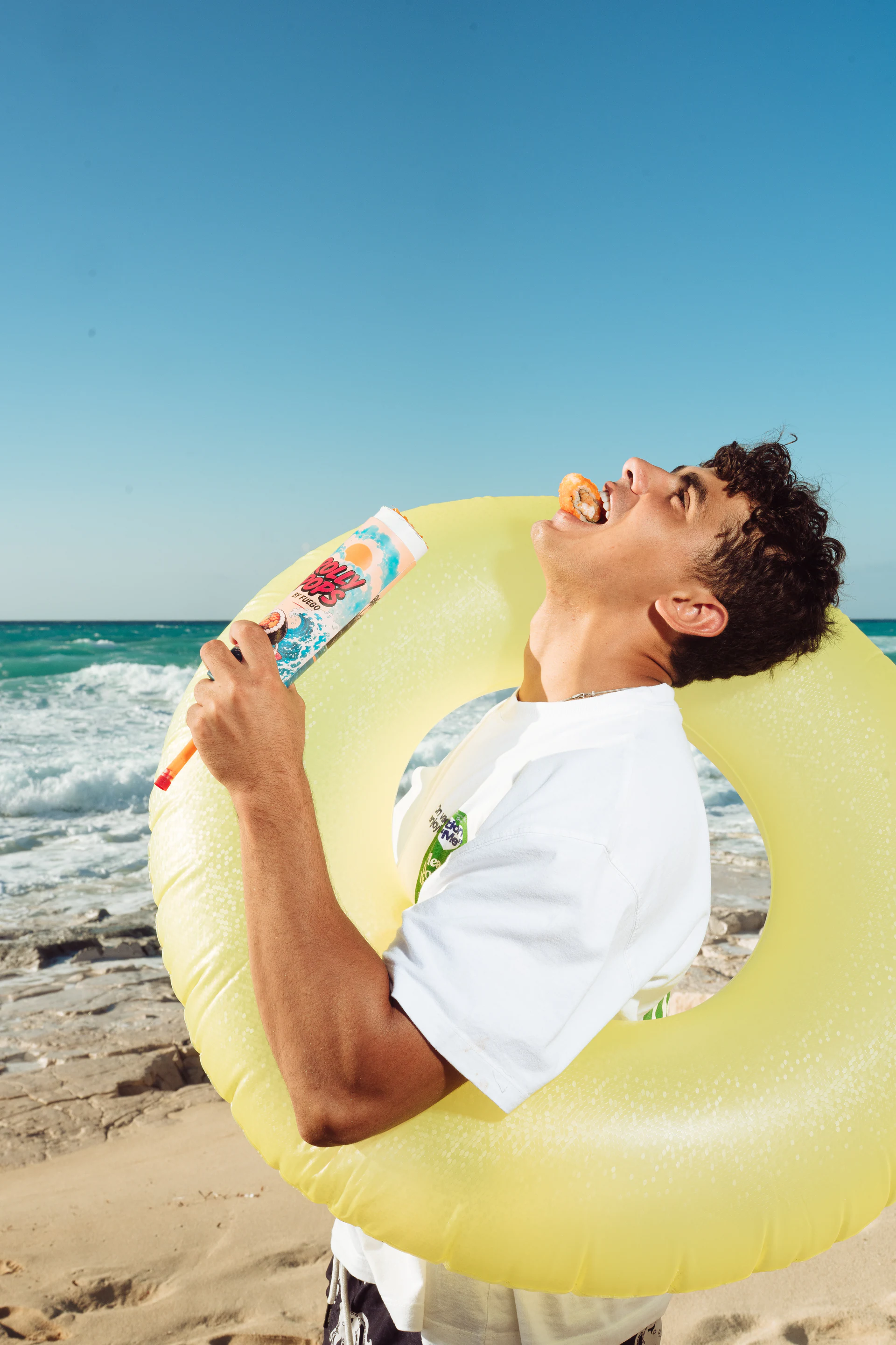Beachgoer enjoying Rolly Pops beside the North Coast sea