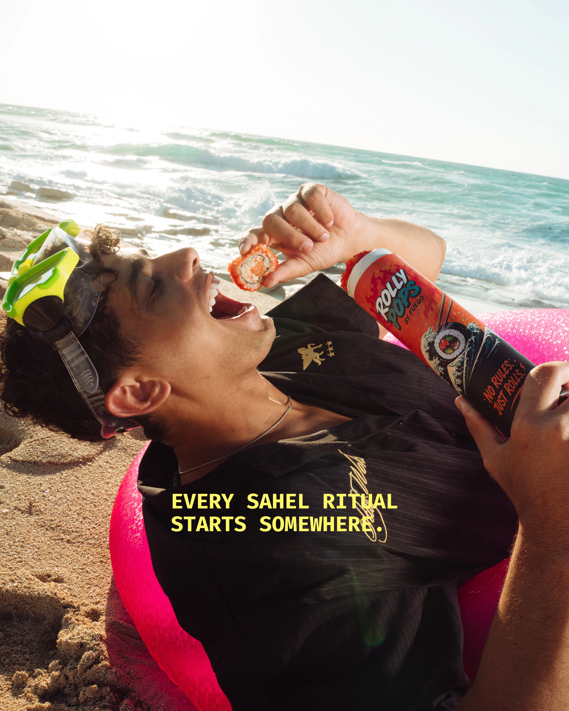 Beachgoer enjoying Rolly Pops with the Every Sahel Ritual Starts Somewhere campaign message